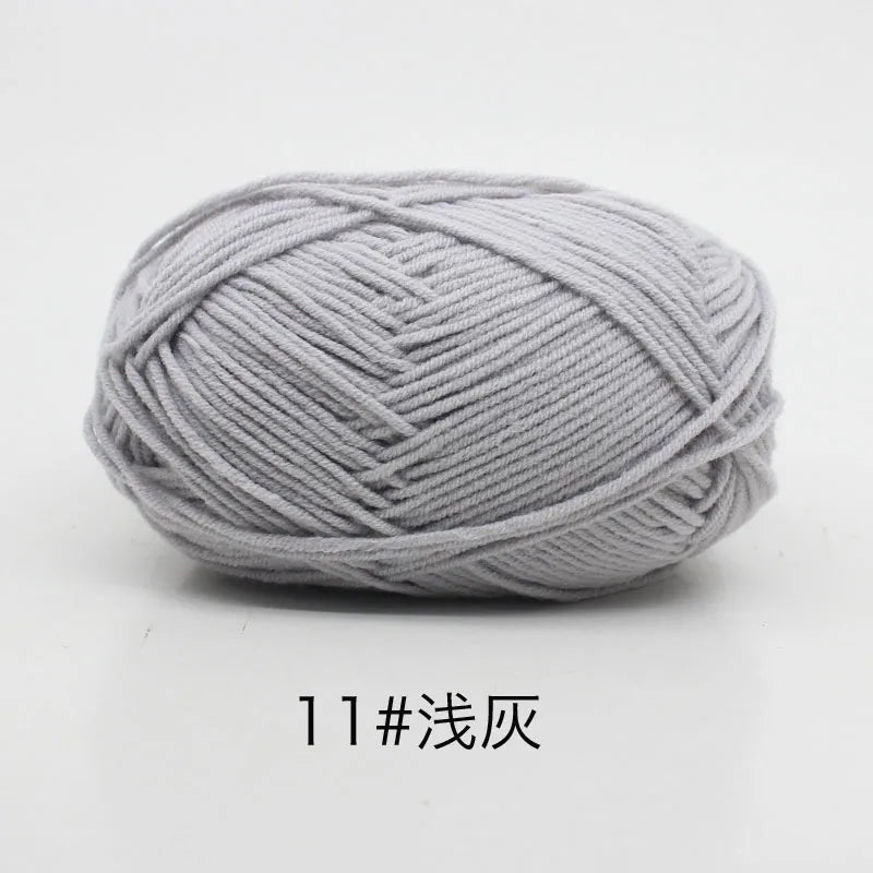 A ball of light gray 11-ply yarn for knitting and crochet.