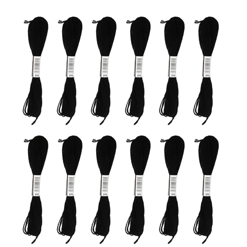A set of 24 embroidery floss in white and black colors displayed in individual spools.