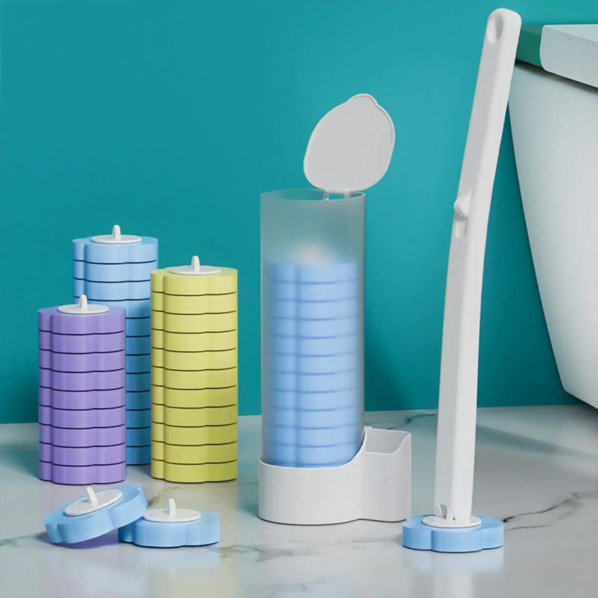 A wall-mounted disposable toilet brush set with replaceable heads in blue and green colors on a white countertop.