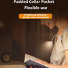 A woman is using a mini night-light book light for reading while sitting with a child.