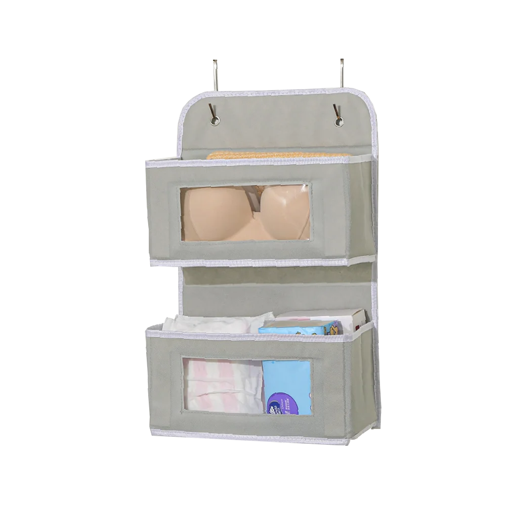 A beige over-the-door hanging organizer with two compartments for storing items.