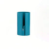 A teal portable wrapping paper cutter with a sliding blade visible inside the casing.