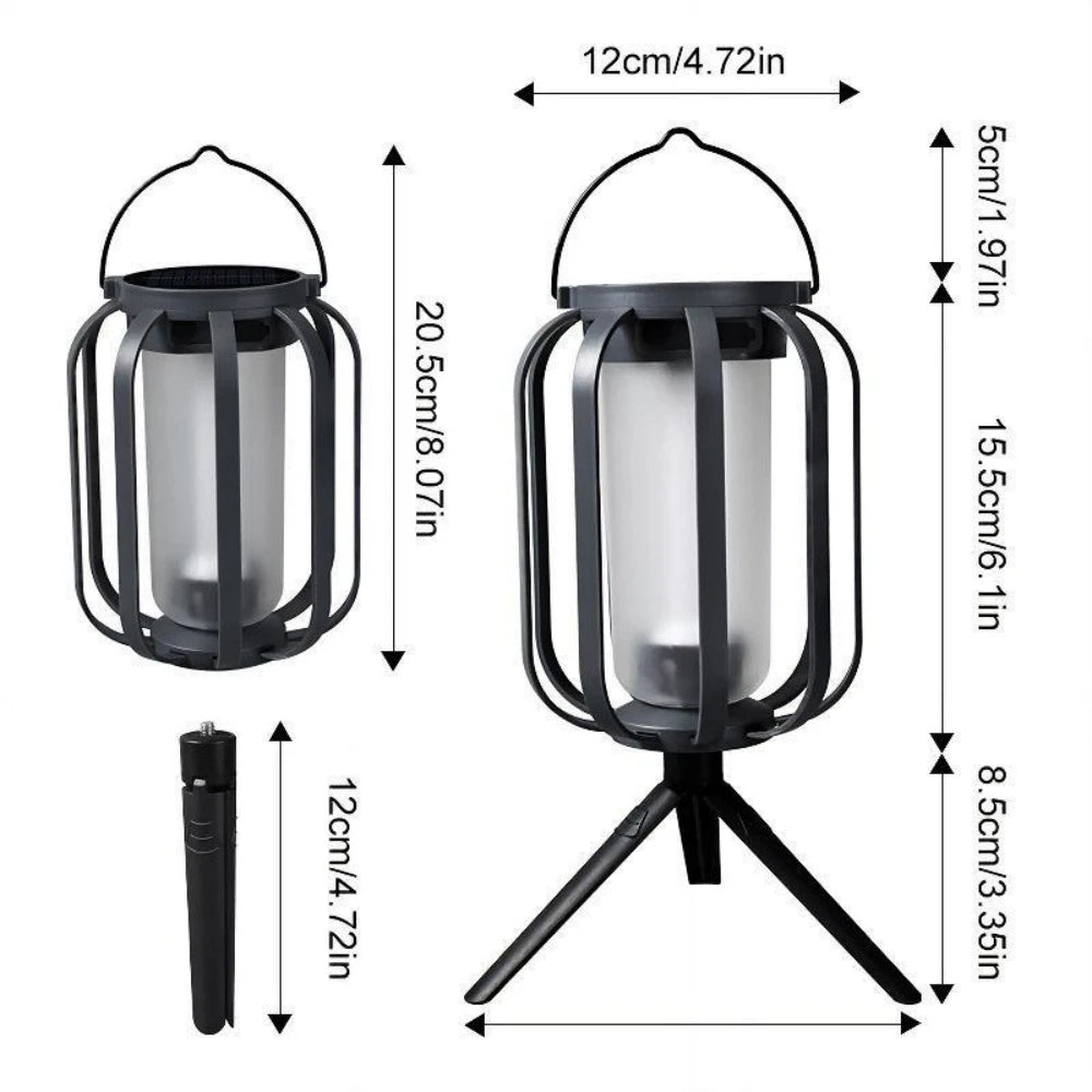 A black solar flickering flame lantern with a hanging design and a separate light bulb.