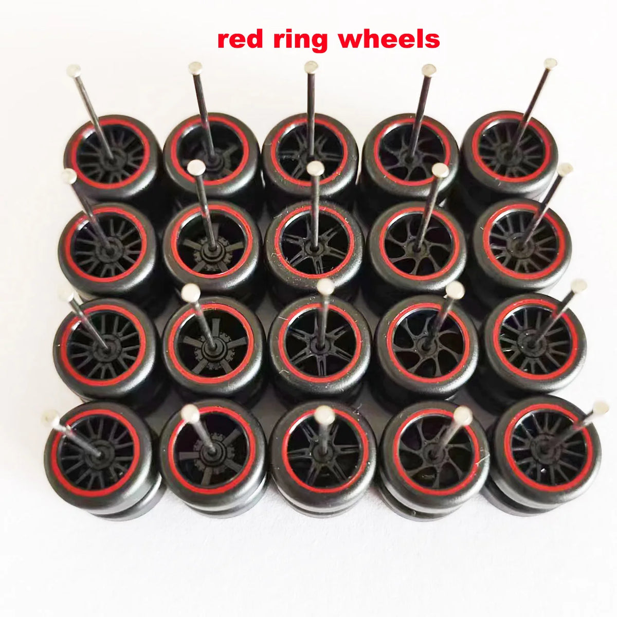 A set of ten red ring wheels used for model cars, showing the wheels and tires.