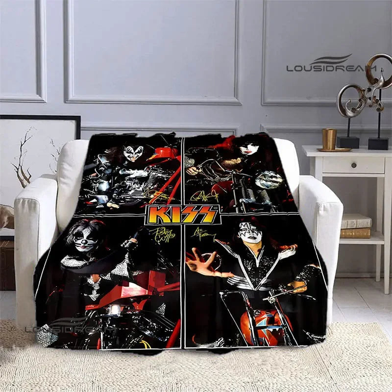A black and white printed flannel throw blanket featuring the Kiss band logo and imagery.