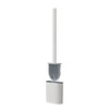 A wall-mounted toilet brush set featuring a long handle and a silicone brush head.