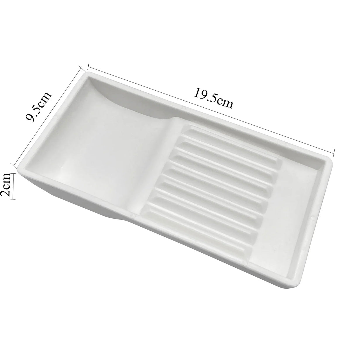 White plastic drawer organizer tray with a slotted section for dental instruments
