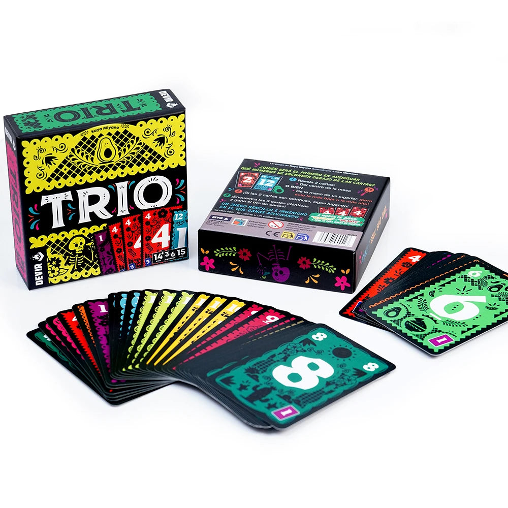 A box of the Trio card game featuring colorful cards and a deck of cards on a white surface.