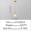 A crystal pendant light fixture with an iron frame suspended from the ceiling.