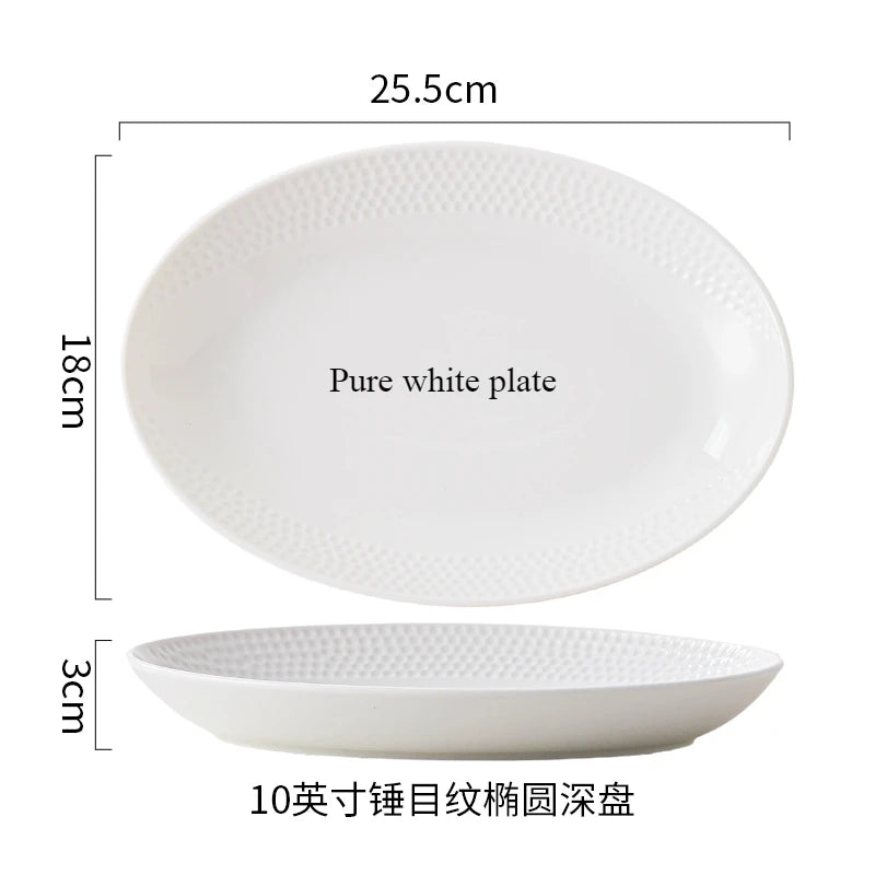 A set of white ceramic tableware including a plate and a soup bowl.