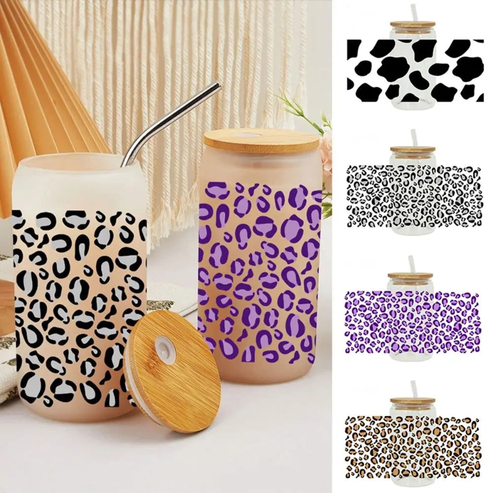 A set of reusable cup wraps and stickers featuring various leopard print patterns on white ceramic cups.