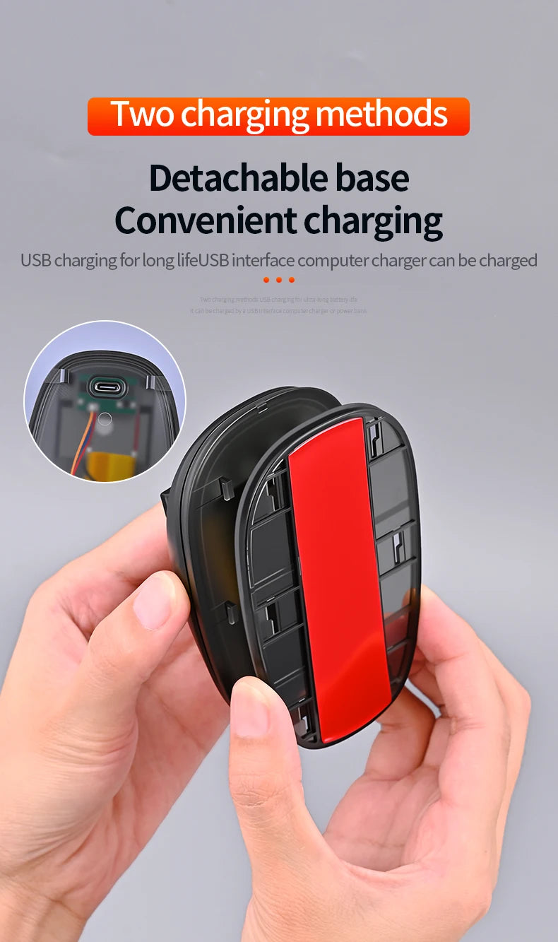 A hand holds a black detachable base charging module for a USB interface computer charger.