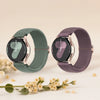 A pair of dark green and purple braided nylon watch bands displayed on a light background.