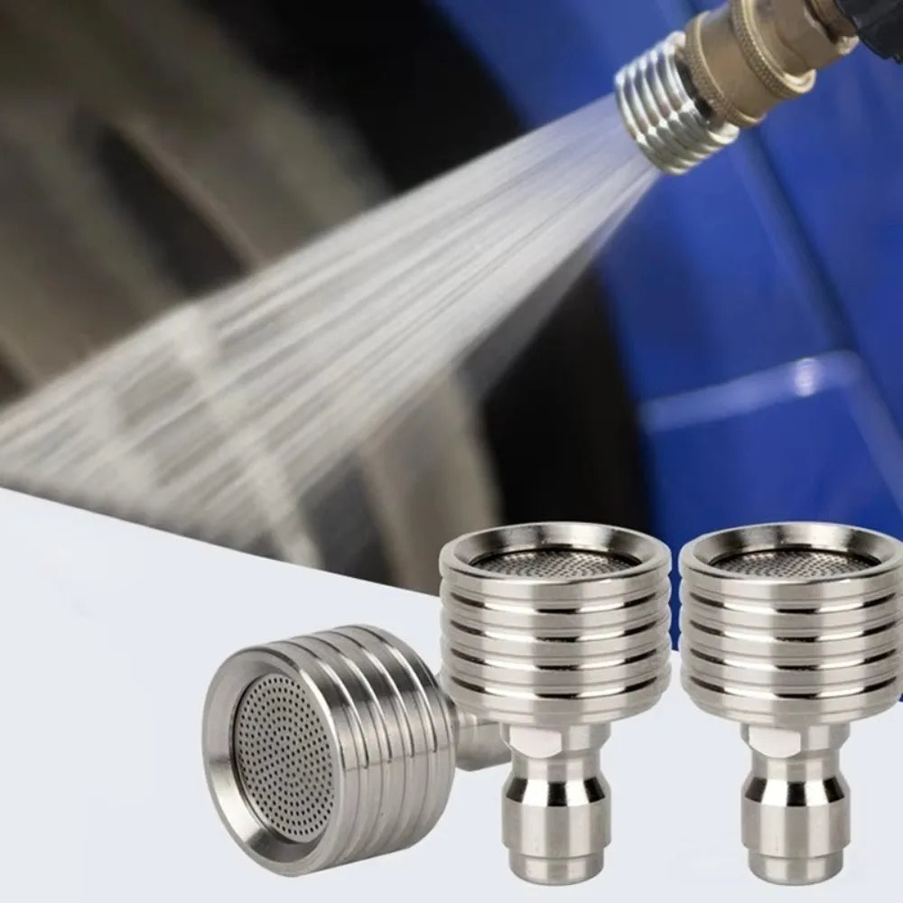Stainless steel high-pressure washer nozzle with 1/4 quick connect visible against a blurred blue background.