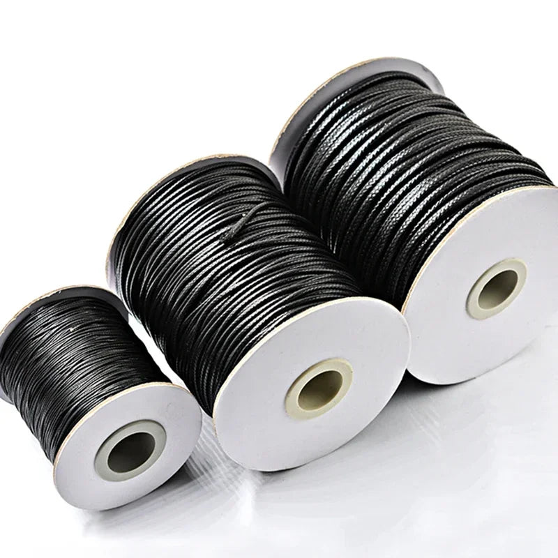 Spool of black waxed cord rope for jewelry making and DIY projects