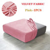 Pink velvet fabric sofa cover displayed on a gray sofa cushion.