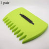 A pair of bright lime green ergonomic leaf grabber rake with black blades.