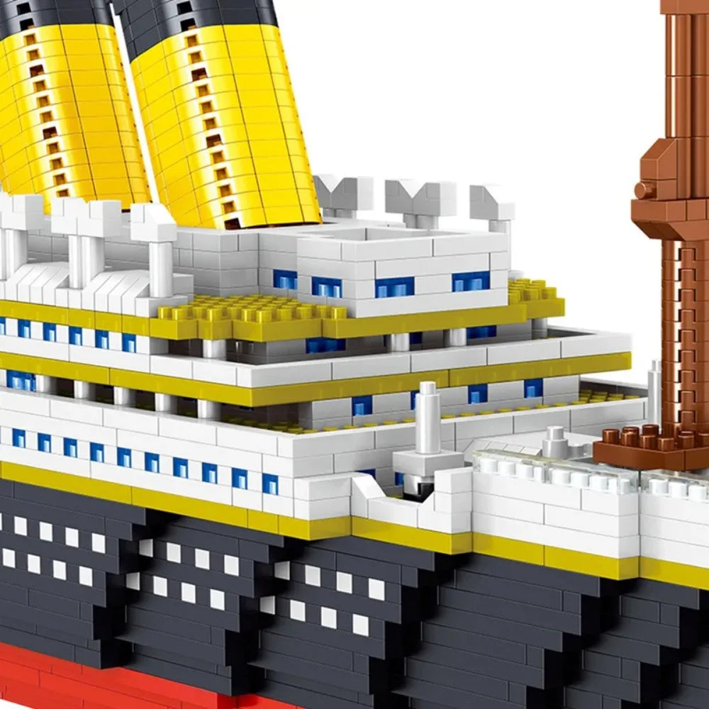 A close-up of a large scale model kit built from LEGO bricks depicting the hull and superstructure of a ship, featuring yello