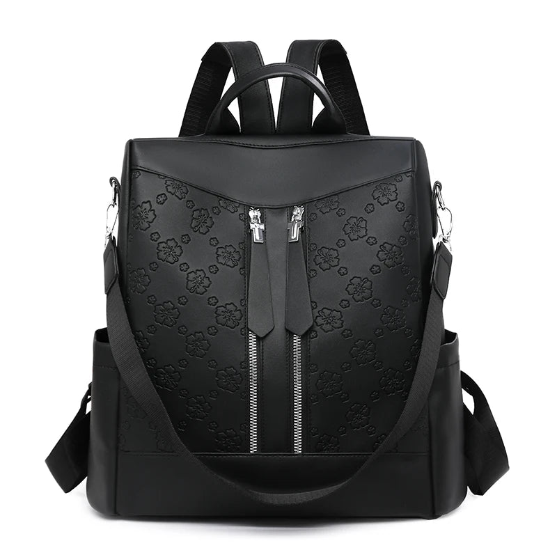 Black leather anti-theft backpack with padded straps and zippered compartments