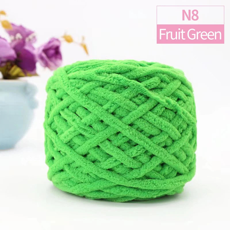 A ball of bright green fruit green chenille yarn labeled N8 for knitting and crochet projects.
