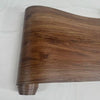 A close-up view of a brown wood grain peel and stick wall decal.
