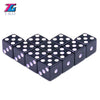 A set of ten black plastic game dice with multi-colored dots arranged in a honeycomb pattern.