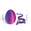 A purple articulated dragon figurine shaped like an egg, displayed next to a measuring scale.