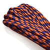 A close-up of a 100 ft, 7-strand paracord rope in an orange and blue pattern.