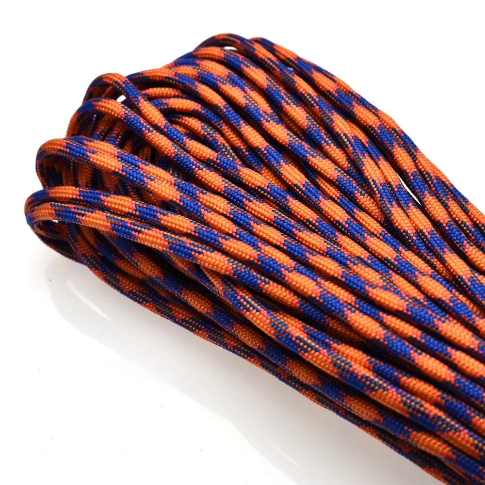 A close-up of a 100 ft, 7-strand paracord rope in an orange and blue pattern.