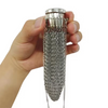 A hand holds a handcrafted stainless steel coin purse with a textured chain design.