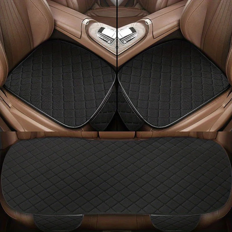 A set of three universal car seat covers made of cotton-linen material in a brown color shown in a folded view.