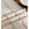 Beige boho table runner with tassels featuring a hand-woven farmhouse style texture.
