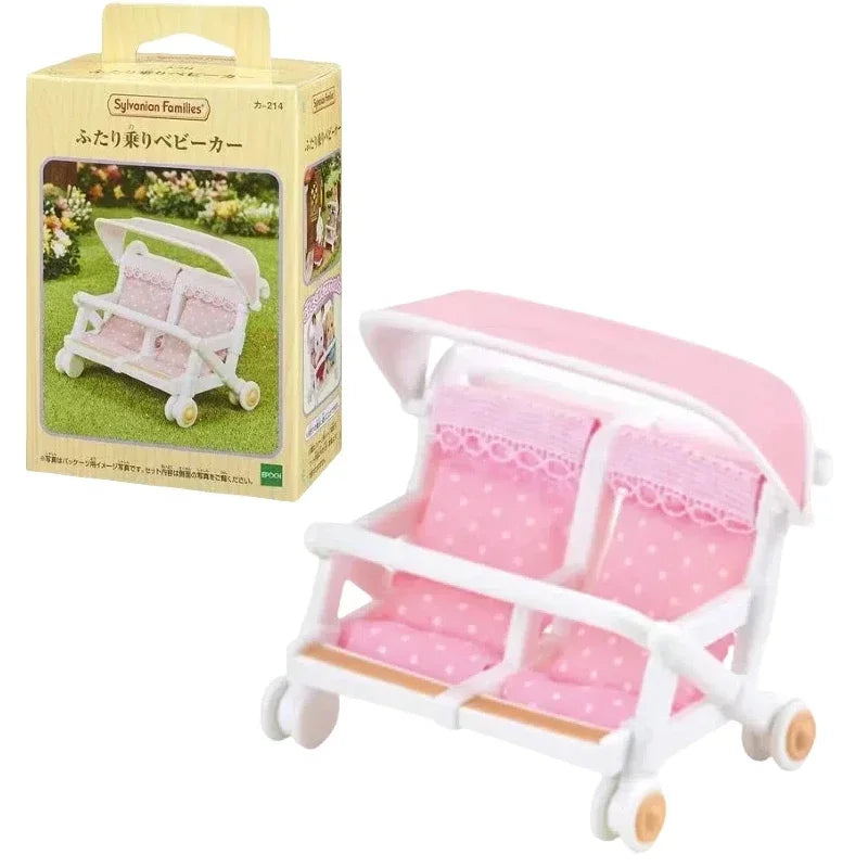 Pink and white Sylvanian Families baby carrier with a canopy for a doll.