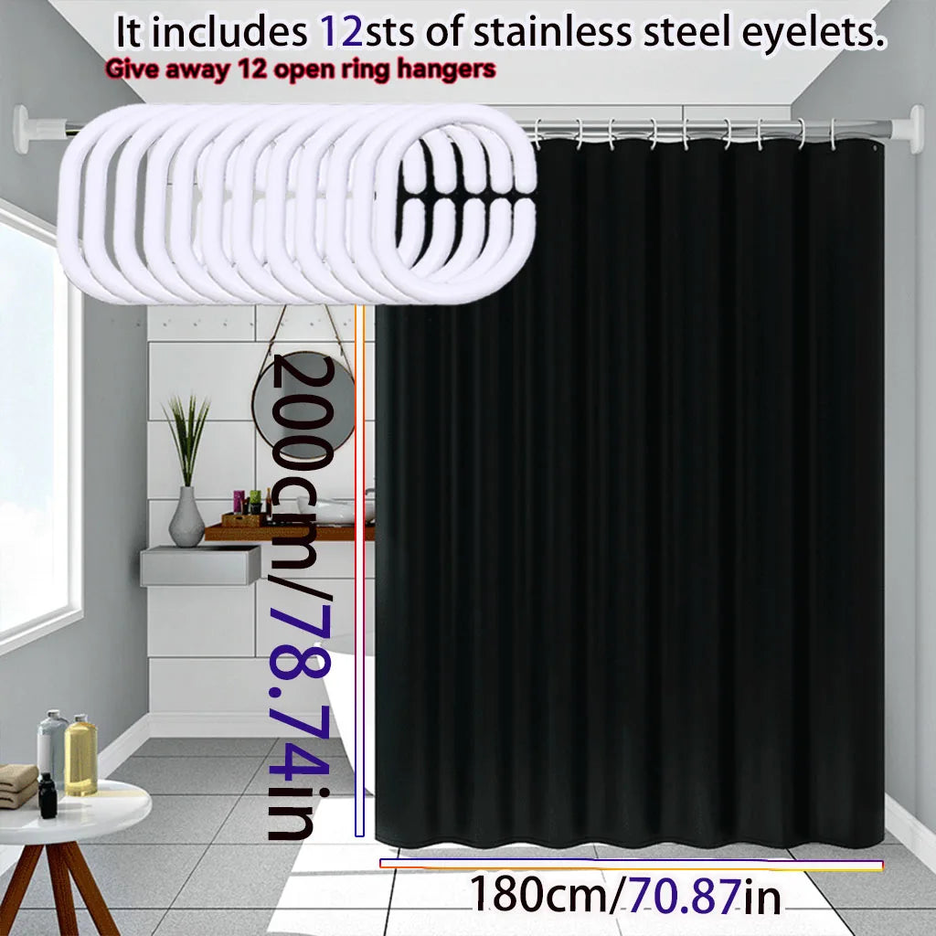 Solid black waterproof PEVA shower curtain hanging on a rod with stainless steel eyelets.