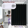 Solid black waterproof PEVA shower curtain hanging on a rod with stainless steel eyelets.