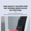 A hand holds a red silicone door lock shock-absorbing pad designed to buffer the impact of closing a car door.