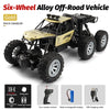 Gold six-wheel alloy off-road RC crawler vehicle with large tires and accessories