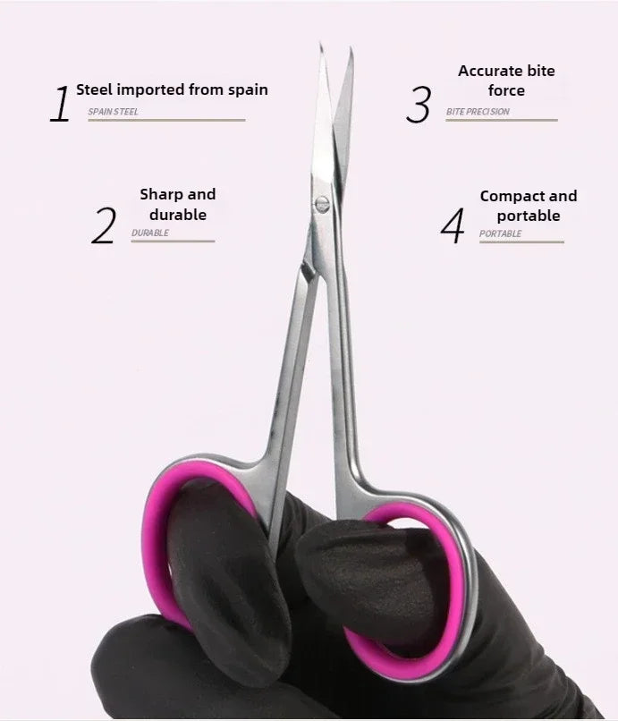 A pair of professional stainless steel cuticle scissors held by a gloved hand, demonstrating their compact and portable desig