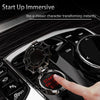 A hand presses the start engine button on a black car ignition, demonstrating an immersive start-up feature.