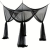 Black floor-to-ceiling mosquito net with a double opening draped in the air.