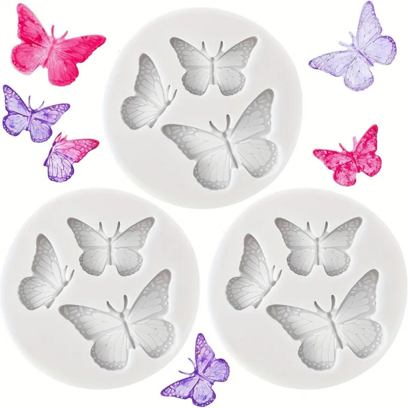 A collection of silicone butterfly molds in various shades of pink, purple, and gray for crafting.