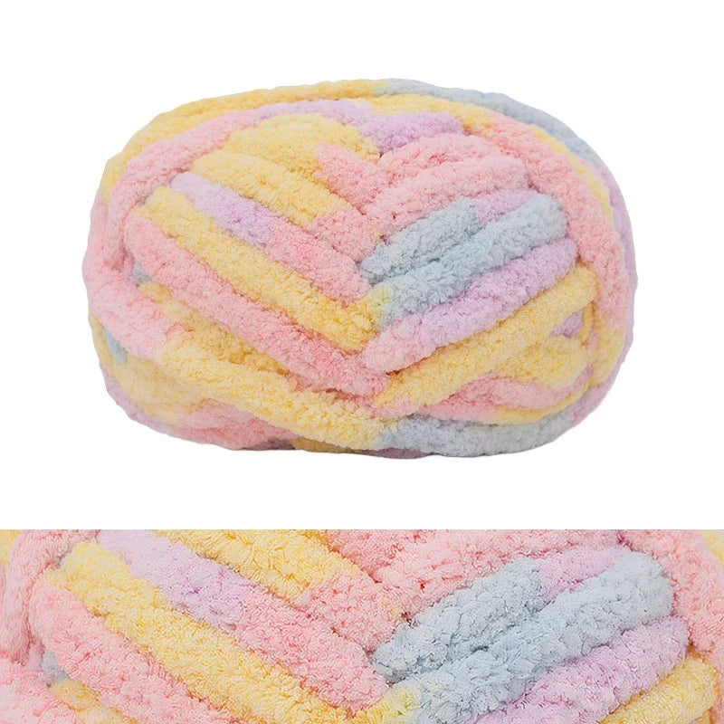 A ball of chunky chenille yarn in pastel colors including pink, yellow, and light blue.