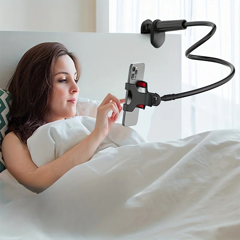 A woman is using a flexible gooseneck phone holder to view her phone while lying in bed.
