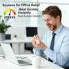A man uses a pink squishy butter fidget toy to relieve stress in an office setting.