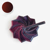 A dark purple 3D illusion fidget star with a swirling spiral design and a black textured handle.