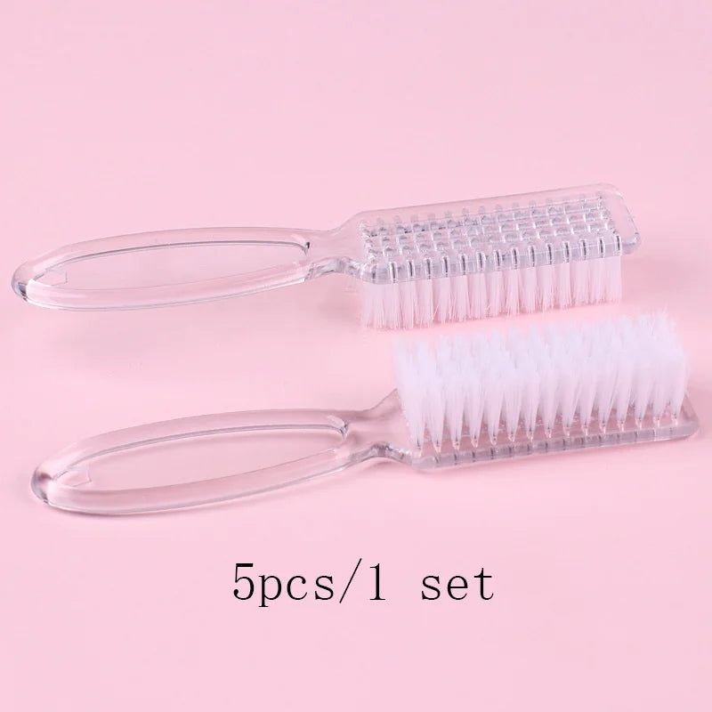 A set of five clear plastic nail art brushes with long handles displayed on a pink background.