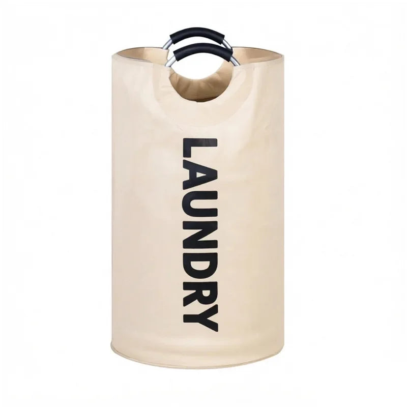 A tall, beige foldable laundry basket with black padded handles.