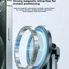 Close-up of a silver magnetic phone holder accessory with two circular rings, demonstrating strong magnetic attraction for de