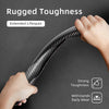 A hand is holding a black carbon fiber texture steering wheel cover, demonstrating rugged toughness and extended lifespan.