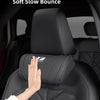 A hand is placing a black headrest neck pillow on a car seat, demonstrating its support features.